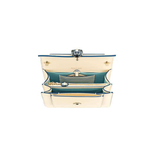 Serpenti Forever small crossbody bag in emerald green calf leather with amethyst purple grosgrain lining. Captivating snakehead closure in light gold-plated brass embellished with black and white agate enamel scales and green malachite eyes. 1082-CLa image 4