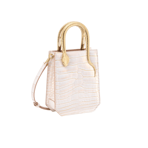 Serpentine mini tote bag in white Moonpearl alligator skin with crystal rose nappa leather lining. Captivating snake body-shaped handles in light gold-plated brass embellished with engraved scales and red enamel eyes. 293444 image 2