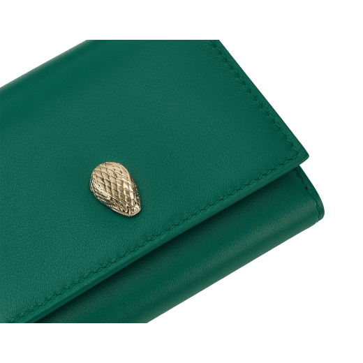 Serpenti Forever crossbody card holder in jade green Metropolitan calf leather with amethyst purple, lavender and sheer amethyst lilac nappa leather side details, and black moiré lining. Captivating magnetic snakehead closure in light gold-plated brass embellished with red enamel eyes. SEACCACCOWSTRAP image 3