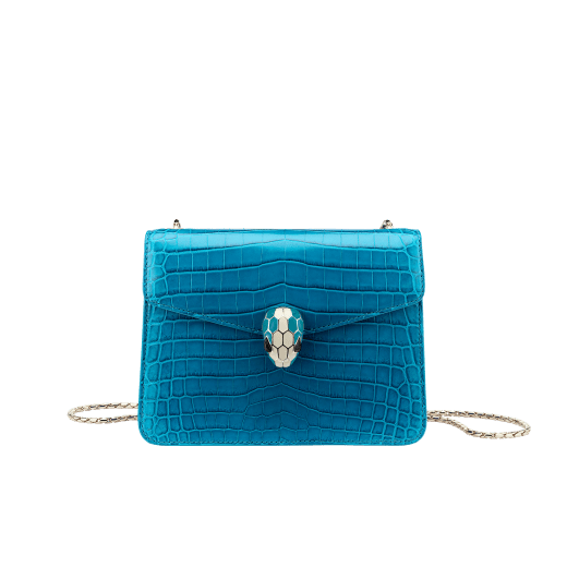 “Serpenti Forever” crossbody bag in white agate crocodile skin with an iridescent and pearled effect. Iconic snake head closure in light gold plated brass enriched with black enamel and mother-of-pearl scales, and blue lapis lazuli eyes. 422-CR image 1