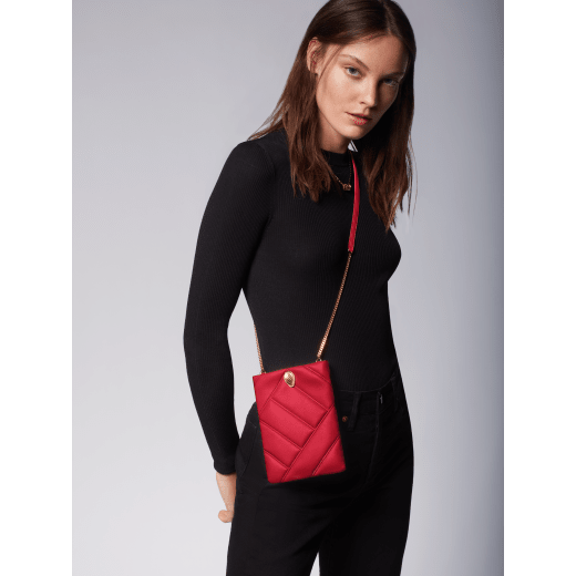 Serpenti Cabochon smart hybrid case in soft, black calf leather with maxi matelassé pattern and black nappa leather interior. Captivating, magnetic snakehead closure in gold-plated brass with with red enamel eyes. SCB-HYBRID image 5