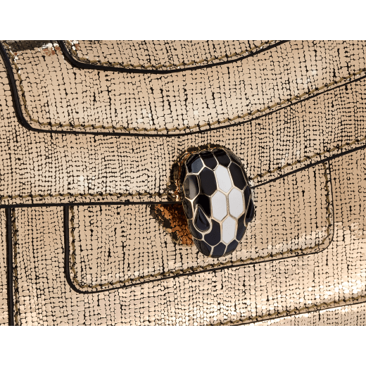 Serpenti Forever mini crossbody bag in light gold Nightbird calf leather with black nappa leather lining. Captivating snakehead magnetic closure in light gold-plated brass embellished with black and white agate enamel scales and black onyx eyes. 986-NCL image 5