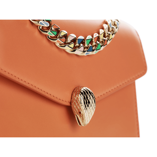 "Serpenti Forever" maxi chain pochette in Blush Quartz pink calf leather and Deep Garnet burgundy nappa leather. New Serpenti head closure in gold-plated brass, finished with red enamel eyes. SEA-XLCHAINPOUCH image 4