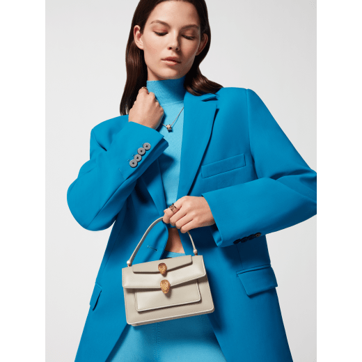 Alexander Wang x Bulgari small belt bag in moonbeam pearl light grey calf leather with black nappa leather lining. Captivating double Serpenti head magnetic closure in antique gold-plated brass embellished with red enamel eyes. 292315 image 6