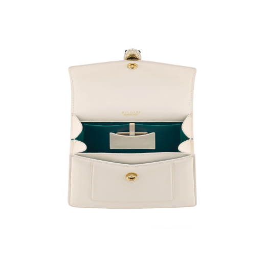 Serpenti Forever medium top handle bag in emerald green calf leather with black nappa leather lining. Captivating snakehead magnetic closure in light gold-plated brass embellished with deep jade intense green enamel and light gold-plated brass scales, and black onyx eyes. SEA-1282-CL image 3