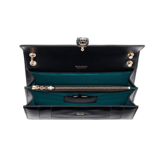 Serpenti Forever medium shoulder bag in black calf leather with emerald green grosgrain lining. Captivating snakehead closure in light gold-plated brass embellished with black and white agate enamel scales and green malachite eyes. 1089-Cla image 3