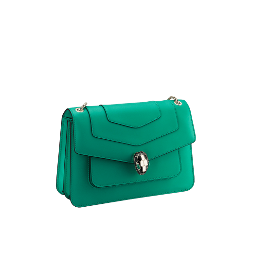 Serpenti Forever medium shoulder bag in black calf leather with emerald green grosgrain lining. Captivating snakehead closure in light gold-plated brass embellished with black and white agate enamel scales and green malachite eyes. 1077-CLa image 2