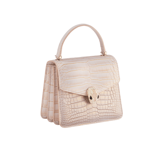 Serpenti Forever small top handle bag in white Moonpearl alligator skin with crystal rose nappa leather lining. Captivating snakehead magnetic closure in light gold-plated brass embellished with white agate enamel and pink quartz scales and black onyx eyes. 293468 image 2
