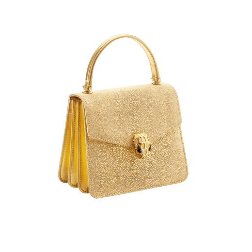 Serpenti Forever top handle bag in gold galuchat skin with black nappa leather lining. Captivating snakehead closure in gold-plated brass embellished with satin-gold scales and black onyx eyes. 752-FG image 2