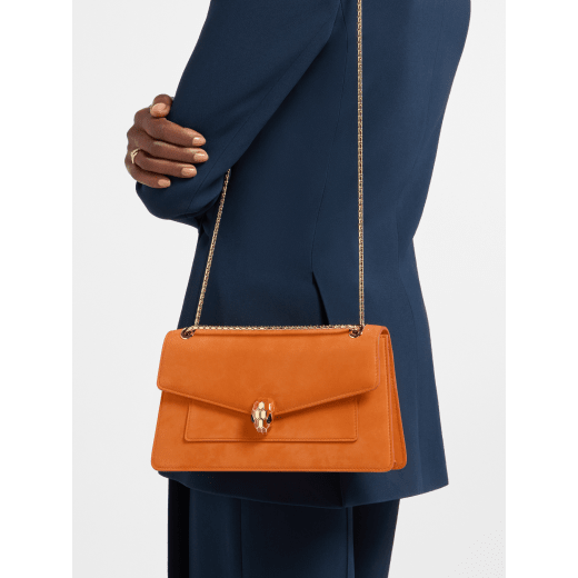 Serpenti Forever medium shoulder bag in black calf leather with black nappa leather lining. Captivating snakehead magnetic closure in light gold-plated brass embellished with beige noisette enamel and light gold-plated brass scales, and black onyx eyes. SEA-001-1344M image 1