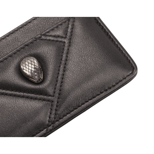 Serpenti Cabochon card holder in black calf leather with maxi matelassé pattern. Captivating snakehead rivet in gold-plated brass embellished with red enamel eyes. SCB-CCHOLDER image 4