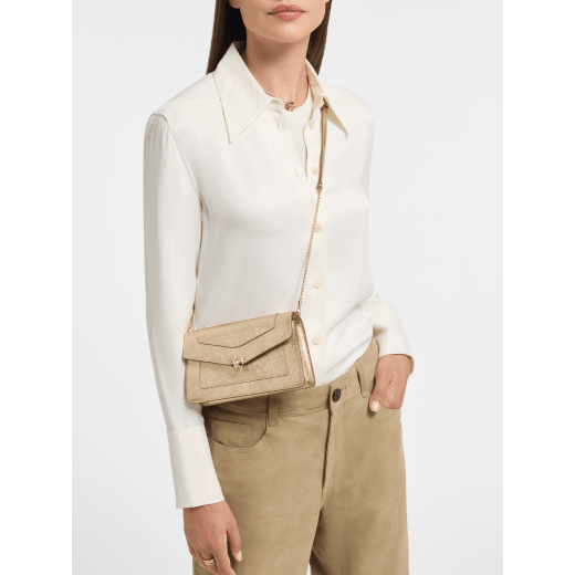 Serpenti Forever chain pochette in Perla White calf leather with crystal rose nappa leather lining. Captivating snakehead magnetic closure in gold-plated brass embellished with Perla White enamel and gold-plated scales, and black onyx eyes. SEA-CHPOCHETTER image 1