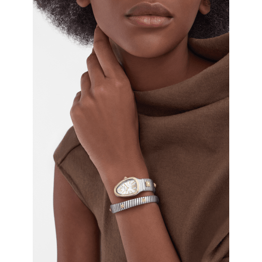 Serpenti Tubogas Studs Capsule single-spiral watch in stainless steel with 18 kt yellow gold diamond-set bezel, 18 kt yellow gold studs on the bracelet, and mother-of-pearl dial. Water-resistant up to 30 metres. Serpenti-Tubogas-Studs-Capsule image 1