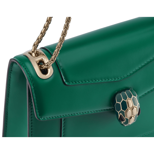 Serpenti Forever Day-to-Night small shoulder bag in emerald green calf leather with black nappa leather lining. Captivating snakehead magnetic closure in light gold-plated brass embellished with deep jade intense green enamel and light gold-plated brass scales, and black onyx eyes. SEA-1281-CL image 5