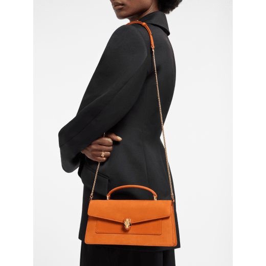 Serpenti Forever Elongated top handle bag in Terracotta nubuck leather with Terracotta nappa leather lining. Captivating snakehead magnetic closure in light gold-plated brass embellished with Terracotta enamel and gold-plated brass scales, and black onyx eyes. 295620 image 1
