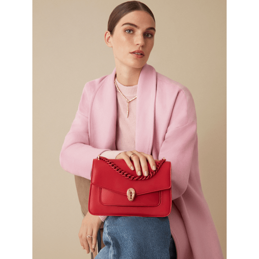 "Serpenti Forever" maxi chain crossbody bag in Amaranth Garnet red nappa leather, with Pink Spinel fuchsia nappa leather inner lining. New Serpenti head closure in gold-plated brass, finished with small red carnelian scales in the middle and red enamel eyes. 1138-MCNa image 6