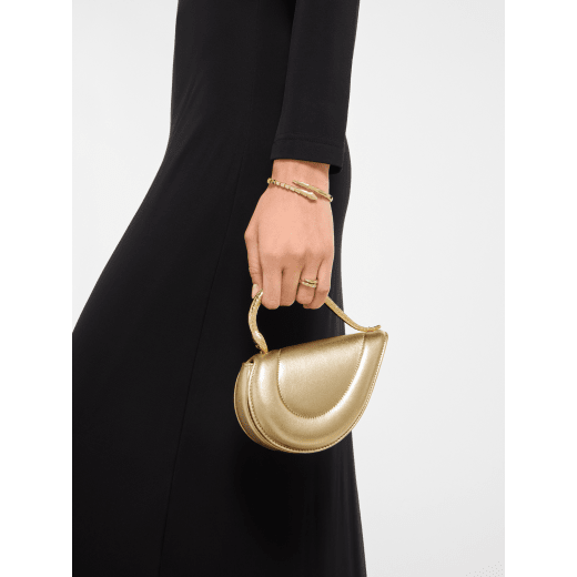 Serpenti Cuoricino mini top handle bag in royal ruby calf leather with royal ruby nappa leather lining. Captivating snake body-shaped top handle in gold-plated brass embellished with engraved scales; press-button closure. SRN-Cuoricino-1366XS image 1