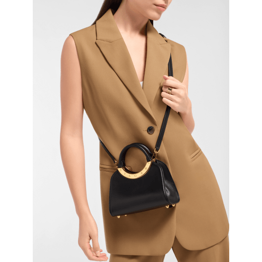 Bvlgari Roma mini top handle bag in flash diamond white Metropolitan calf leather with milky opal nappa leather lining. Iconic metal detail in palladium-plated brass engraved with the Bvlgari logo, and magnetic press-button closure. BVR-001-1310XS-CALF image 1
