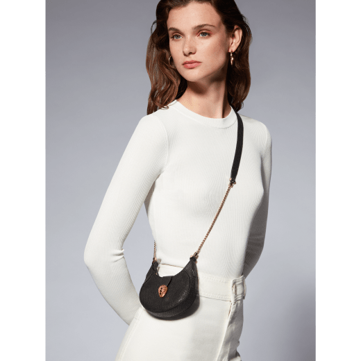 Serpenti Ellipse micro crossbody bag in moon silver black metallic karung skin with black nappa leather lining. Captivating snakehead closure in gold-plated brass embellished with red enamel eyes. SEA-MICROHOBOa image 6
