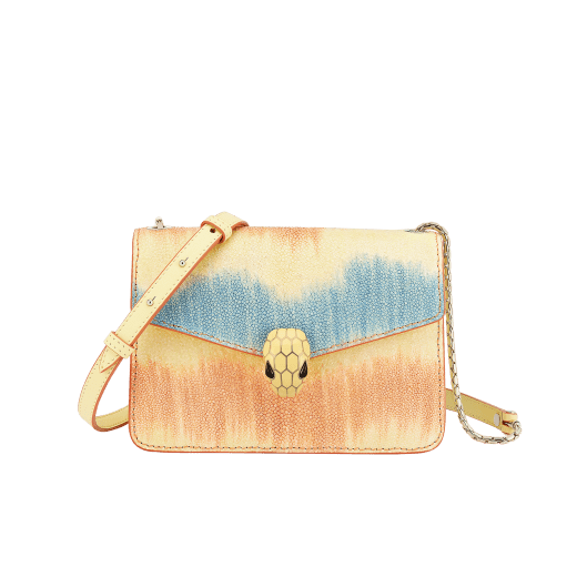 “Serpenti Forever” crossbody bag in daisy topaz full galuchat skin body and daisy topaz calf leather sides. Iconic snakehead closure in light gold plated brass enriched with black and white enamel and black onyx eyes. 1093-G image 1