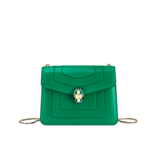 Serpenti Forever small crossbody bag in vivid emerald green calf leather with beet amethyst fuchsia grosgrain lining. Captivating snakehead magnetic closure in light gold-plated brass embellished with bright forest emerald green enamel and light gold-plated brass scales, and black onyx eyes. 422-CLe image 1