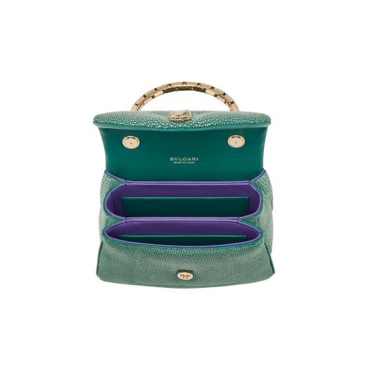 Serpenti Reverse small top handle bag in soft emerald green galuchat skin with amethyst purple nappa leather lining. Captivating magnetic snakehead closure in light gold-plated brass embellished with red enamel eyes. 1234-SG image 4