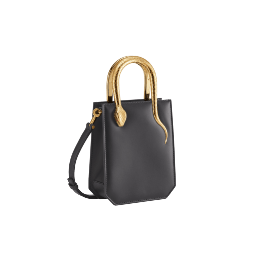 Serpentine mini tote bag in ivory opal Metropolitan calf leather with black nappa leather lining. Captivating snake body-shaped handles in gold-plated brass embellished with engraved scales and red enamel eyes. SEA-1223 image 2