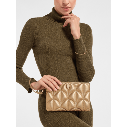 Serpenti Sugarloaf clutch in antique gold calf leather with a distinctive Calla Matelassé motif and Bright Travertino nappa leather interior. Captivating snakehead rivet in light gold-plated brass embellished with red enamel eyes; zip closure. 294416 image 1