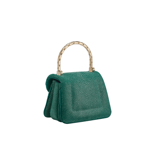 Serpenti Reverse micro top handle bag in soft emerald green galuchat skin with black nappa leather lining. Captivating magnetic snakehead closure in light gold-plated brass embellished with red enamel eyes. SRV-NANOREVERSE image 3