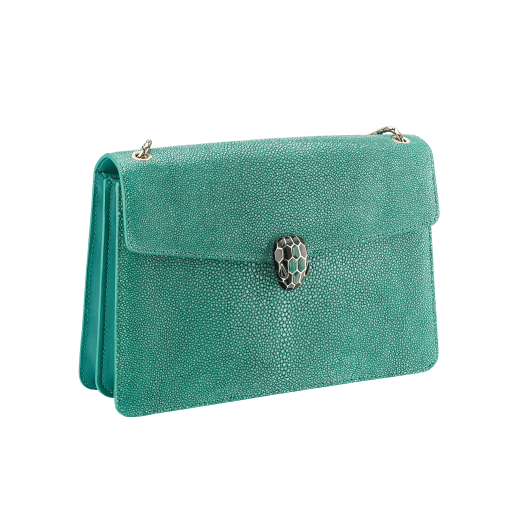 “Serpenti Forever” shoulder bag in emerald green galuchat skin. Iconic snake head closure in light gold plated brass enriched with black enamel, malachite scales and black onyx eyes. 289026 image 2