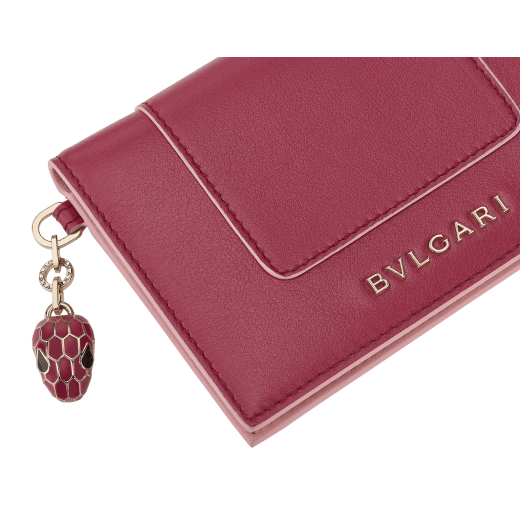 Serpenti Forever card holder in emerald green calf leather with violet amethyst nappa leather interior. Captivating snakehead charm in light gold-plated brass embellished with black and white agate enamel scales and emerald green enamel eyes, and press button closure. SEA-CC-HOLDER-FOLD-Cla image 4