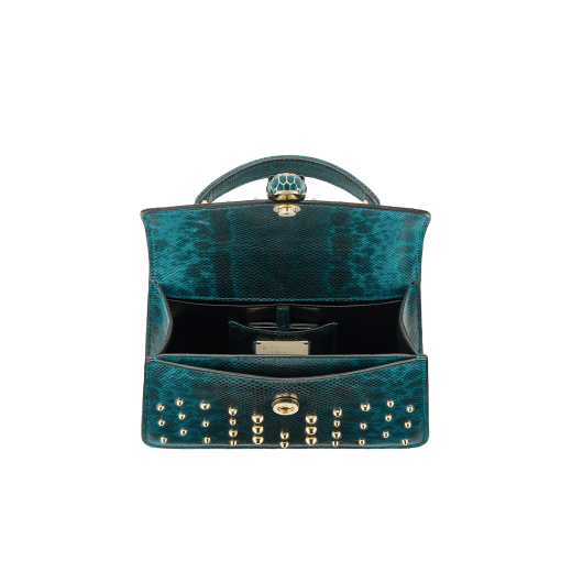 Serpenti Forever mini top handle bag in Laguna blue Cabochon shiny karung skin with metal studs and black nappa leather lining. Captivating snakehead magnetic closure in light gold-plated brass embellished with bright Laguna blue enamel and light gold-plated brass scales, and black onyx eyes. 293746 image 4