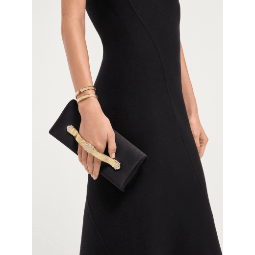 Bvlgari Tubogas evening clutch in black satin with black nappa leather lining. Iconic Tubogas handle in gold-plated brass embellished with zirconia and a magnetic closure. 295432 image 1