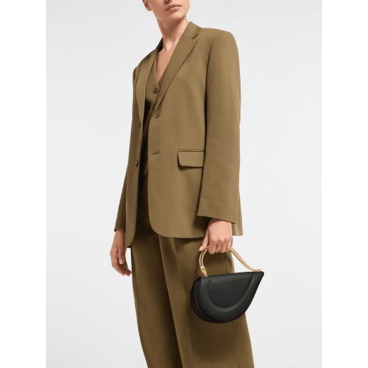 Serpenti Cuore 1968 medium top handle bag in black calf leather with black nappa leather lining. Captivating snake body-shaped top handle in gold-plated brass embellished with engraved scales and zirconia eyes; press-button closure. 294670 image 1