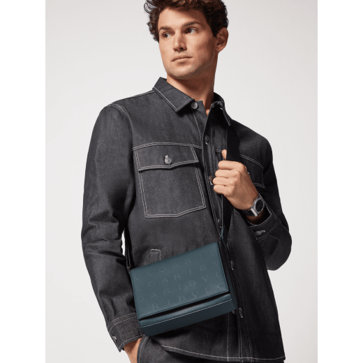 BULGARI Man small messenger bag in ivy onyx grey smooth and grainy metal-free calf leather with Olympian sapphire blue regenerated nylon (ECONYL®) lining. Dark ruthenium-plated brass hardware, hot stamped BULGARI logomania motif and magnetic flap closure. BMA-1213-CLb image 7