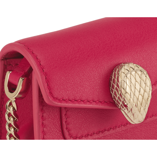 Serpenti Forever micro bag in gold calf leather. Captivating snakehead closure in light gold-plated brass embellished with red enamel eyes. SEA-NANOCROSSBODYa image 4