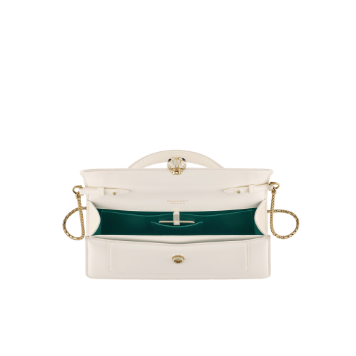 Serpenti Forever Elongated top handle bag in black calf leather with black nappa leather lining. Captivating snakehead magnetic closure in light gold-plated brass embellished with black enamel and light gold-plated brass scales, and black onyx eyes. SEA-001-1390S image 3