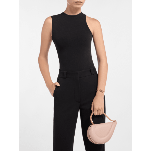 Serpenti Cuore 1968 top handle bag in star rose pink calf leather with crystal rose nappa leather lining. Captivating snake body-shaped top handle in gold-plated brass embellished with star rose pink enamel scales and zirconia eyes; press-button closure. SRN-001-1326S image 1