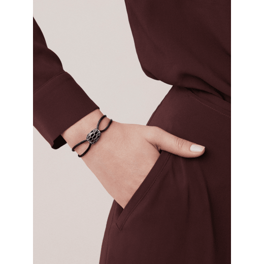 Serpenti Forever bracelet in emerald green fabric. Light gold-plated brass captivating snakehead décor embellished with emerald green and black enamel scales, and black enamel eyes. SERP-STRINGd image 1