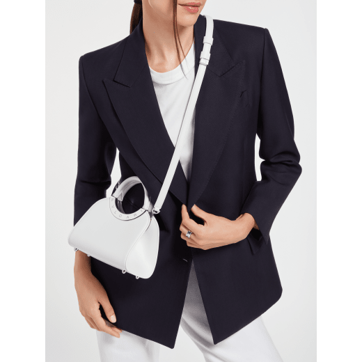 Bvlgari Roma mini top handle bag in flash diamond white Metropolitan calf leather with milky opal nappa leather lining. Iconic metal detail in palladium-plated brass engraved with the Bvlgari logo, and magnetic press-button closure. BVR-001-1310XS-CALF image 2