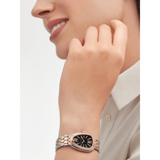 Serpenti Seduttori watch with stainless steel case, 18 kt rose gold bezel set with 38 round brilliant-cut diamonds, black lacquered dial, stainless steel and 18 kt rose gold bracelet with folding buckle. Water-resistant up to 30 metres 103951 image 1