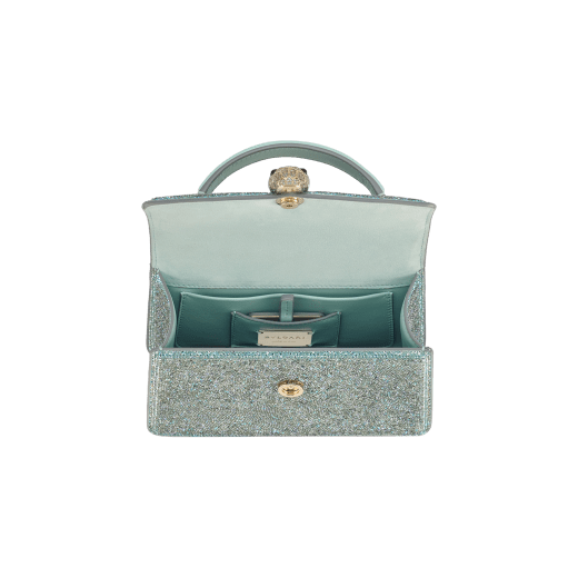 Serpenti Forever mini top handle bag with acquamarine crystals inserts hand-set on suede leather and aquamarine nappa leather lining. Captivating snakehead magnetic closure in light gold-plated brass embellished with light blue zirconia pavé and light gold-plated brass scales, and black onyx eyes. 293889 image 3