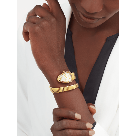 Serpenti Tubogas single spiral watch in 18 kt yellow gold case and bracelet, bezel set with brilliant cut diamonds and silver opaline dial. 101924 image 1
