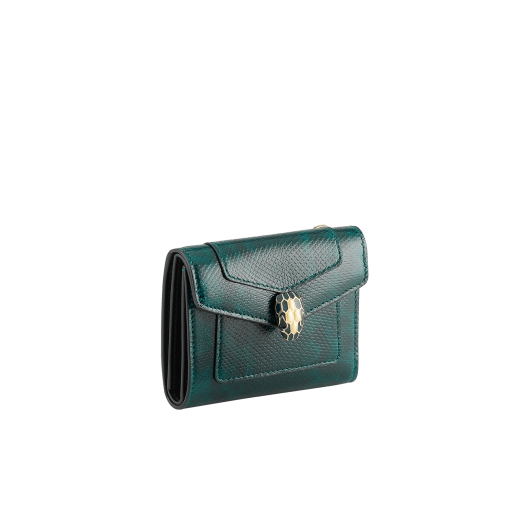 Serpenti Forever compact wallet in shiny midnight plum karung with black nappa leather interior. Captivating snakehead press-button closure in palladium-plated brass embellished with midnight plum enamel and palladium-plated brass scales and black enamel eyes. SEA-SLIM-COMPACT-R-kar image 1