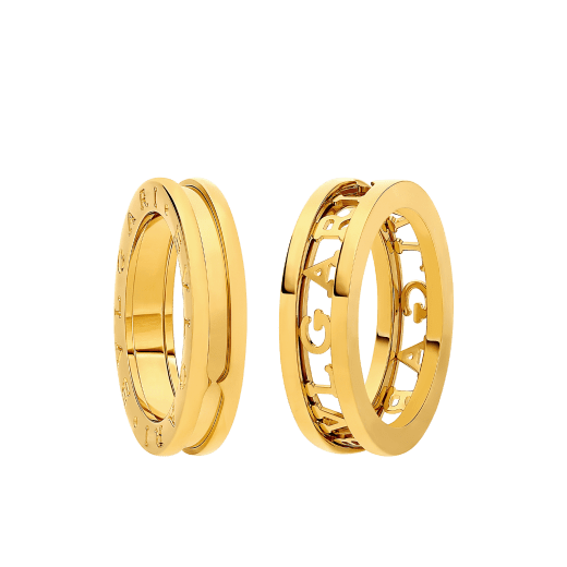 B.zero1 couples' rings in 18 kt yellow gold, one of which has an openwork Bulgari logo. A distinctive ring set fusing visionary design with bold charisma. BZERO1-COUPLES-RINGS-9 image 1