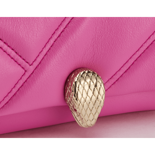 Serpenti Cabochon micro bag in gold calf leather with a maxi matelassé pattern and black nappa leather lining. Captivating snakehead closure in light gold-plated brass embellished with red enamel eyes. SCB-NANOCABOCHONb image 4