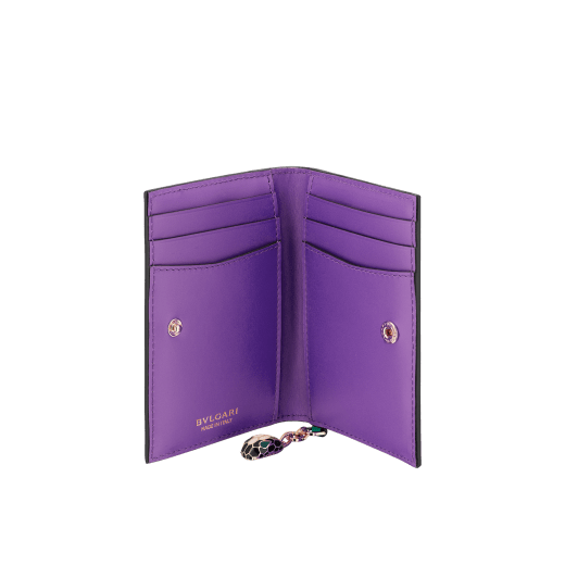 Serpenti Forever card holder in emerald green calf leather with violet amethyst nappa leather interior. Captivating snakehead charm in light gold-plated brass embellished with black and white agate enamel scales and emerald green enamel eyes, and press button closure. SEA-CC-HOLDER-FOLD-Cla image 2