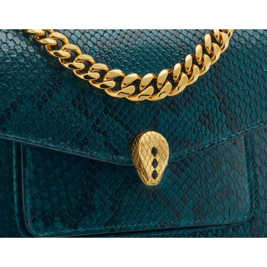 Serpenti Forever Maxi Chain small crossbody bag in soft, shiny anemone spinel pinkish red python skin with black nappa leather lining. Captivating magnetic snakehead closure in gold-plated brass embellished with black onyx scales and red enamel eyes. 1134-SSP image 5