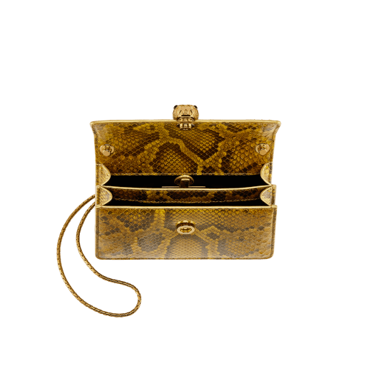 Serpenti Forever mini crossbody bag in gold-shaded python skin with 24 kt gold treatment and black nappa leather lining. Captivating snakehead magnetic closure in gold-plated brass including 3 µ of 24 kt gold and embellished with "diamantatura" engraving on the scales and black onyx eyes. Exclusive Bulgari 50th anniversary in the US Edition. 292592 image 4