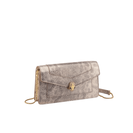 Serpenti Forever chain pochette in milky opal metallic karung with milky opal nappa leather lining. Captivating snakehead magnetic closure in gold-plated brass embellished with foggy opal enamel and black onyx eyes. 294909 image 1